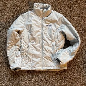 Patagonia light gray jacket with purple accents